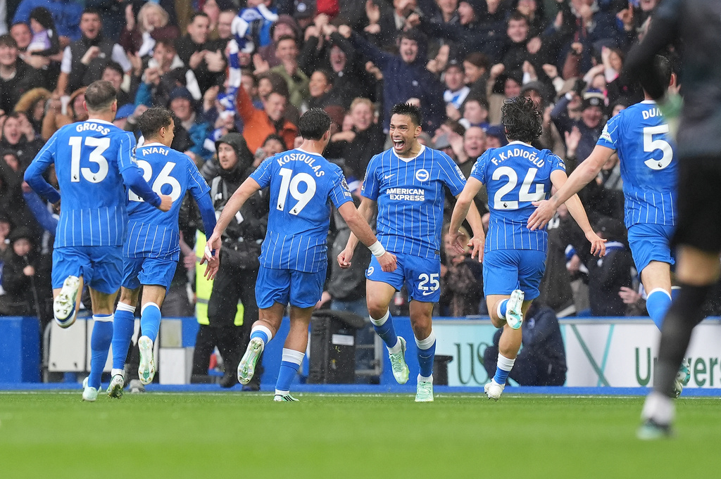 Brighton's Diego Gomez, center, celebrates scoring during the English Premier League soccer match between Brighton and Hove Albion and Crystal Palace in Brighton, England, Sunday, Oct. 18, 2026. (Gareth Fuller/PA via AP)
