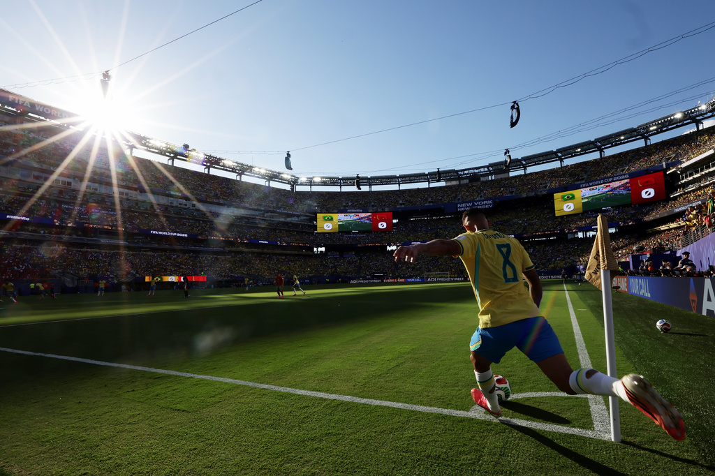 Brazil's Bruno Guimaraes (8) takes a corner kick in the first half during the World Cup Group C soccer match between Brazil and Morocco in East Rutherford, N.J., near New York, Saturday, June 13, 2026. (AP Photo/Adam Hunger)