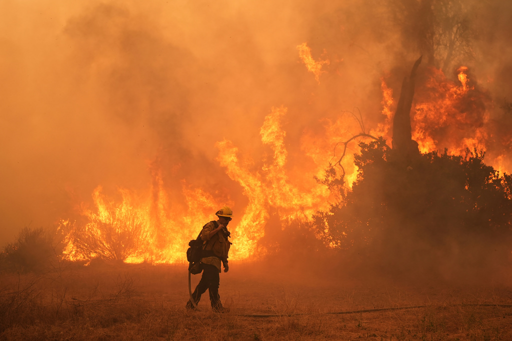 FILE - A firefighter battles the Canyon Fire on Aug. 7, 2025, in Hasley Canyon, Calif. (AP Photo/Marcio Jose Sanchez, File)