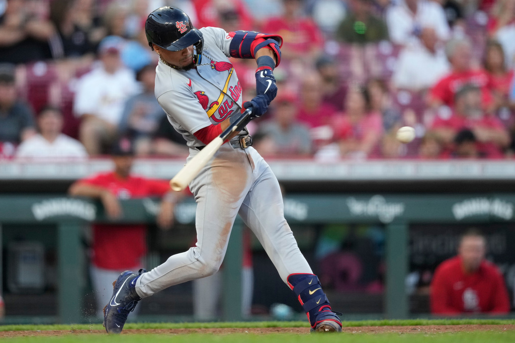 St. Louis Cardinals' Masyn Winn hits a solo home run in the fifth inning of a baseball game against the Cincinnati Reds, Tuesday, Aug. 18, 2026, in Cincinnati. (AP Photo/Carolyn Kaster)