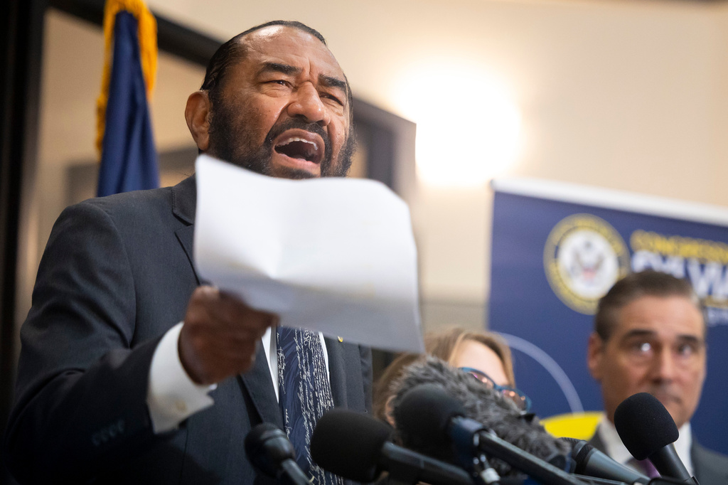 Congressman Al Green reads a version of a letter he wrote during a press briefing outside the office of Congresswoman Sylvia Garcia in Houston, on Friday, July 10, 2026. (AP Photo/Annie Mulligan)