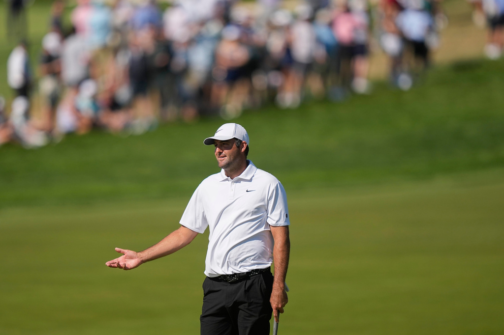 Scottie Scheffler reacts to a missed shot on the 10th green during the third round of the PGA Championship golf tournament at Aronimink Golf Club, Saturday, May 16, 2026, in Newtown Square, PA. (AP Photo/Matt Slocum)