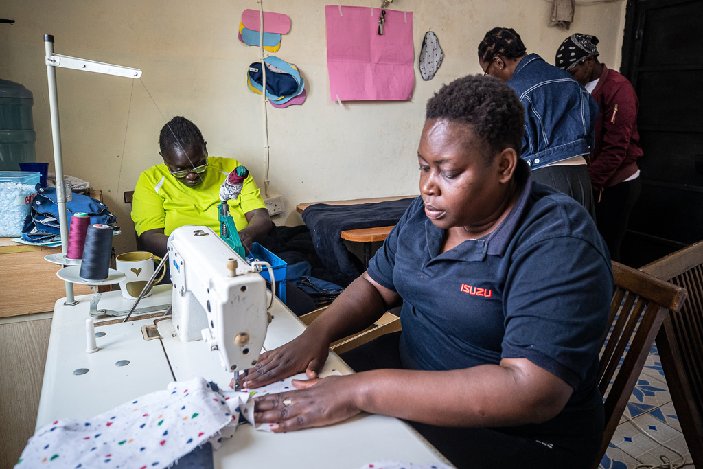 Women sew reusable sanitary pads inside the Fempad NGO workshop in the Kibera informal settlement on the outskirts of Nairobi, Kenya, Feb. 12, 2026. (AP Photo/Atieno Muyuyi)