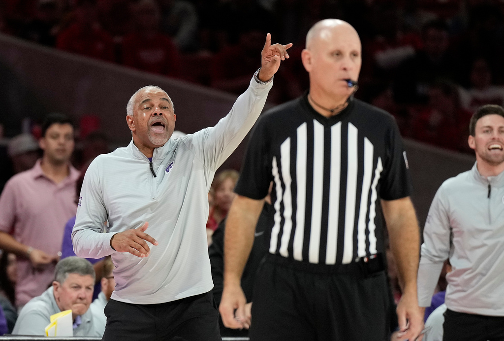 Kansas State head coach Jerome Tang, center left, reacts on the sideline during the second half of an NCAA college basketball game against Houston, Saturday, Feb. 14, 2026, in Houston. (AP Photo/ Karen Warren)