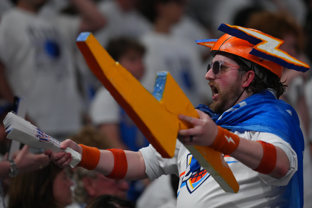 A Oklahoma City Thunder fan cheers in the first half of Game 5 in the Western Conference finals NBA basketball playoffs series between the San Antonio Spurs and the Oklahoma City Thunder, Tuesday, May 26, 2026, in Oklahoma City. (AP Photo/Julio Cortez)