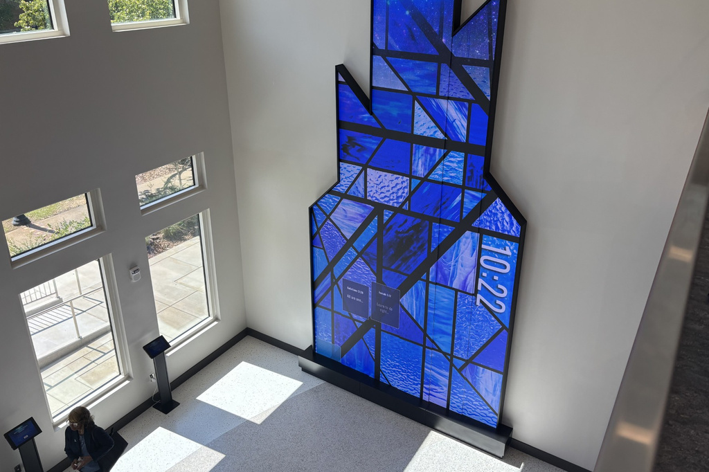 This photo taken with a smartphone shows a person standing inside the visitor and education center at 16th Street Baptist Church in Birmingham, Ala., Tuesday, Sept. 15, 2026. (AP Photo/Kim Chandler)