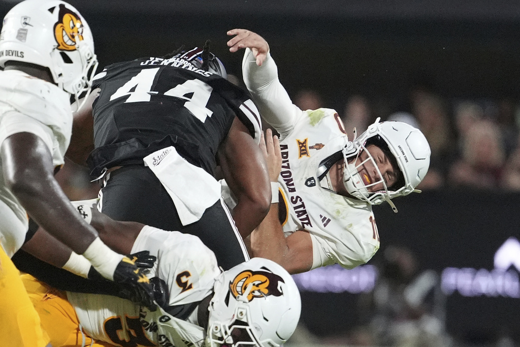 Arizona State quarterback Sam Leavitt (10) reacts after being hit by Mississippi State linebacker Branden Jennings (44) during the first half of an NCAA college football game in Starkville, Miss., Saturday, Sept. 6, 2025. (AP Photo/Rogelio V. Solis)