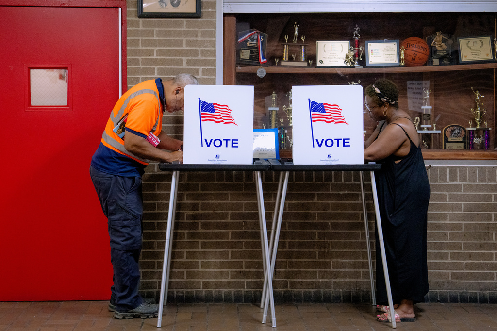 People vote in the primary election at Northwestern High School in Detroit, Tuesday, Aug. 4, 2026. (AP Photo/Nic Antaya)