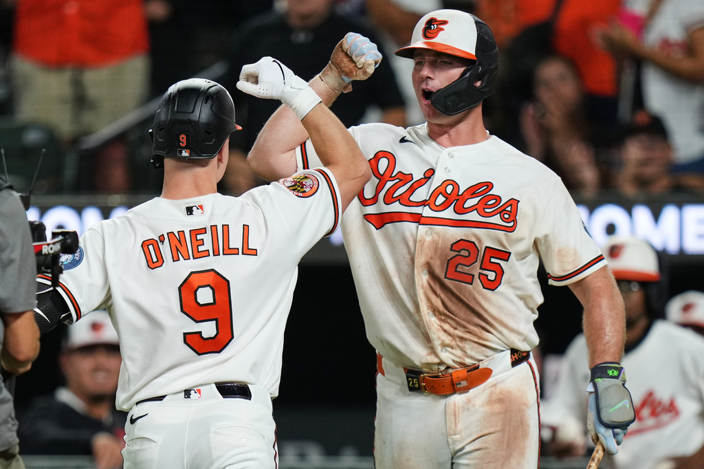 Baltimore Orioles' Tyler O'Neill (9) celebrates with Pete Alonso (25) after hitting a home run during the eighth inning of a baseball game against the Los Angeles Angels, Tuesday, Aug. 4, 2026, in Baltimore. (AP Photo/Stephanie Scarbrough)