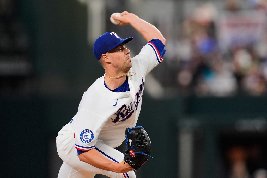 Texas Rangers pitcher MacKenzie Gore throws to the Seattle Mariners in the first inning of a baseball game Wednesday, April 8, 2026, in Arlington, Texas. (AP Photo/Tony Gutierrez)