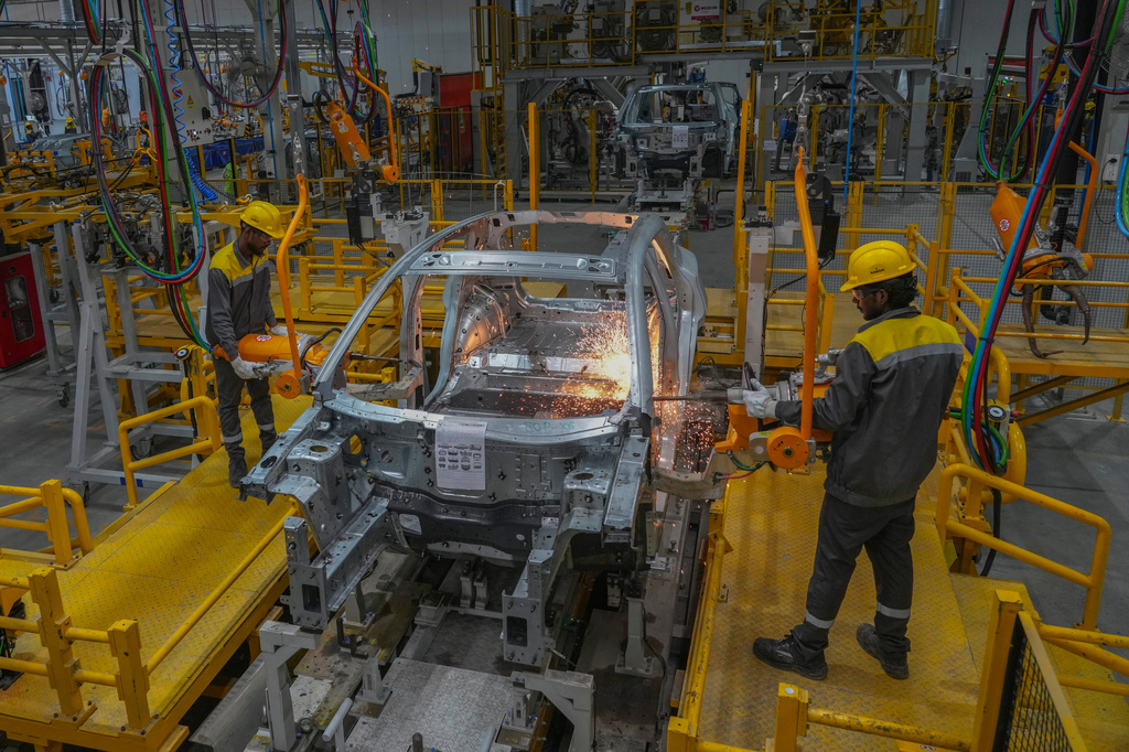 FILE - Workers assemble a car at the VinFast electric vehicle plant in Thoothukudi, in the southern Indian state of Tamil Nadu, Monday, Aug. 4, 2025. (AP Photo/Rafiq Maqbool, File)