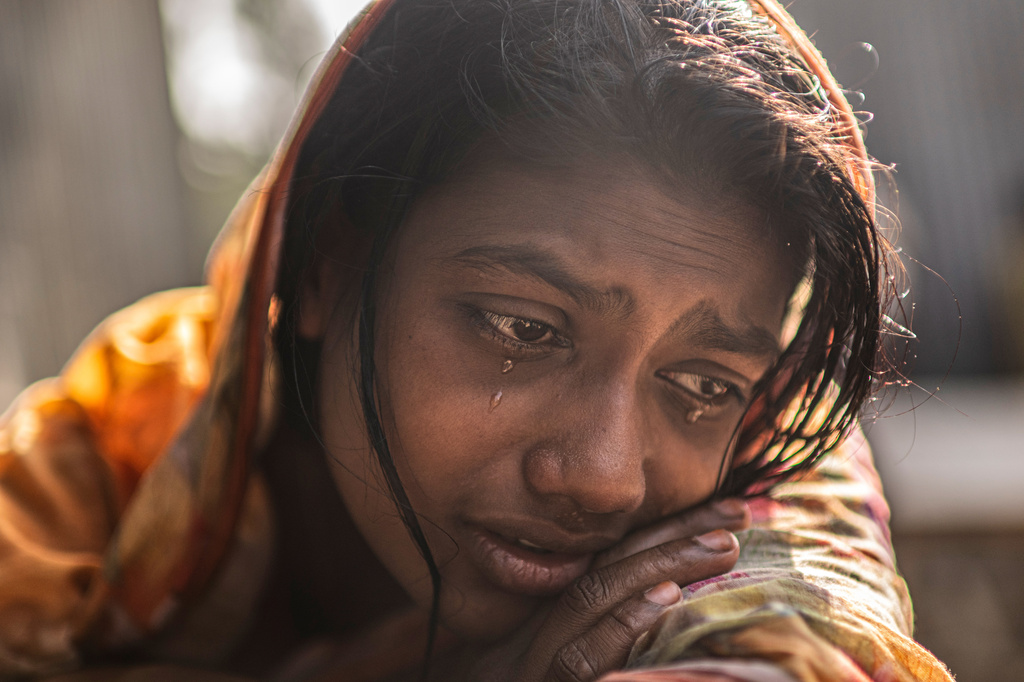 Meghna Rani, wife of Dipu Chandra Das, weeps inside her home in Tarakanda village, Mymensingh District, Bangladesh, Jan. 9, 2026. (AP Photo/Mahmud Hossain Opu)