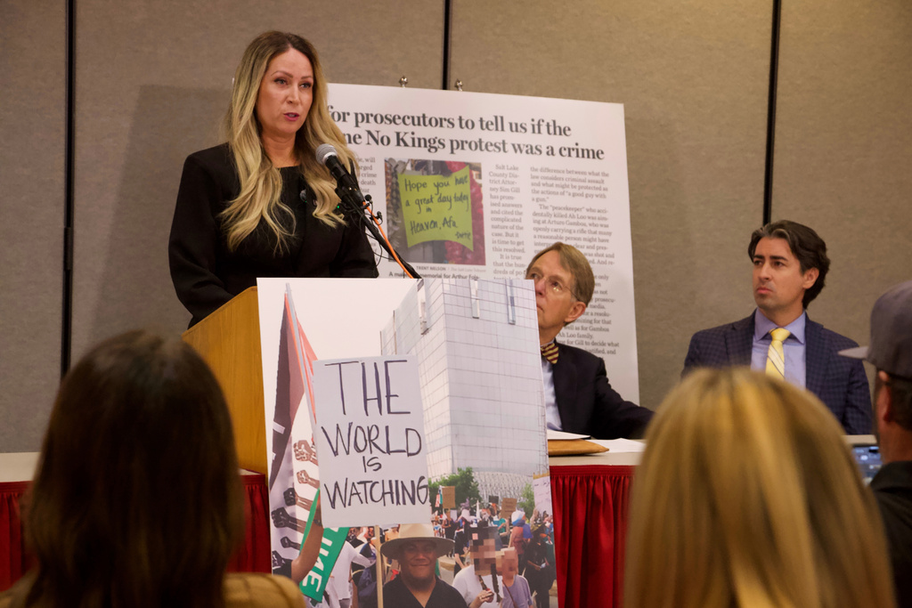 Laura Ah Loo, the widow of a man who was fatally shot during a "No Kings" protest in Salt Lake City in June, speaks to reporters at a news conference in the city, Wednesday, Oct. 29, 2025. (AP Photo/Hannah Schoenbaum)
