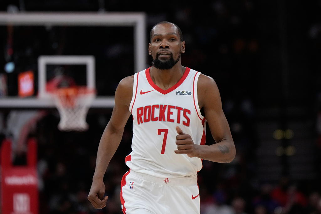 Houston Rockets forward Kevin Durant runs down the court during the first half of an NBA basketball game against the Miami Heat in Houston, Saturday, March 21, 2026. (AP Photo/Ashley Landis)