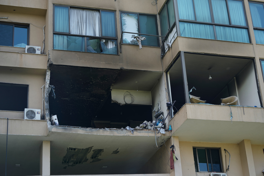 A residential apartment damaged in an Israeli airstrike is seen in Bchamoun, about 10 kilometers (6 miles) southeast of Beirut, Lebanon, Tuesday, March 24, 2026. (AP Photo/Bilal Hussein)