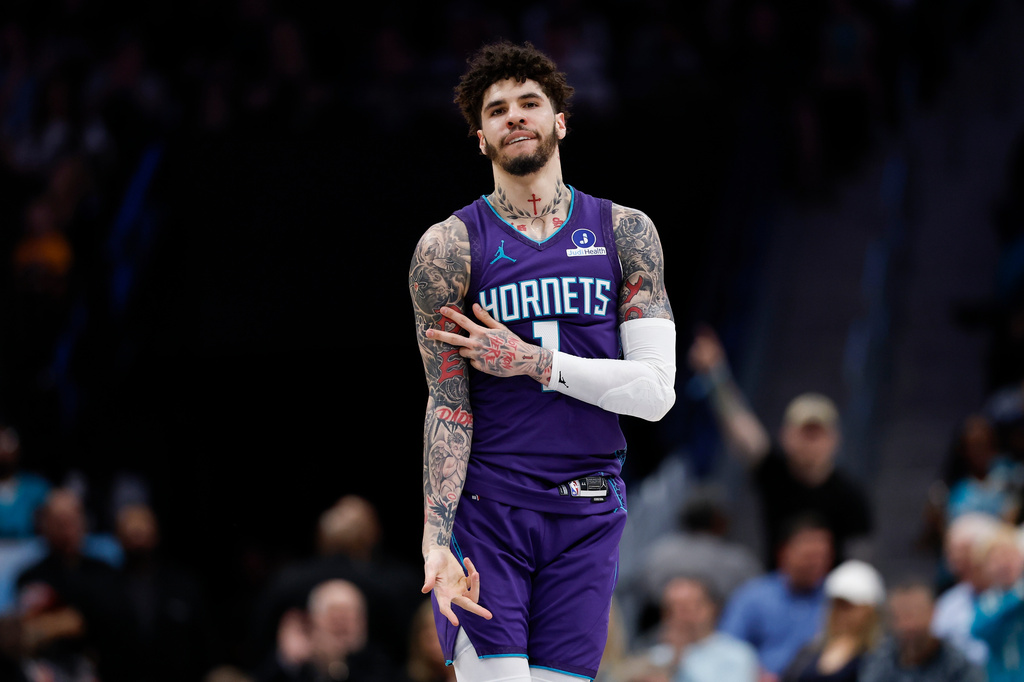 Charlotte Hornets guard LaMelo Ball reacts after making a 3-point basket during the first half of an NBA basketball game against the Indiana Pacers in Charlotte, N.C., Friday, April 3, 2026. (AP Photo/Nell Redmond)