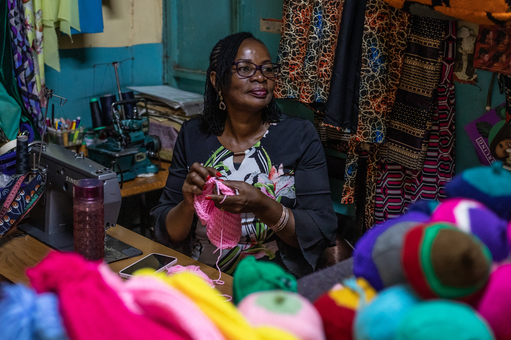 Mary Mwangi, 52, a breast cancer survivor, knits breast prostheses at her shop in Thika, Kiambu County, Kenya, Friday, Jan. 30, 2026. (AP Photo/Samson Otieno)