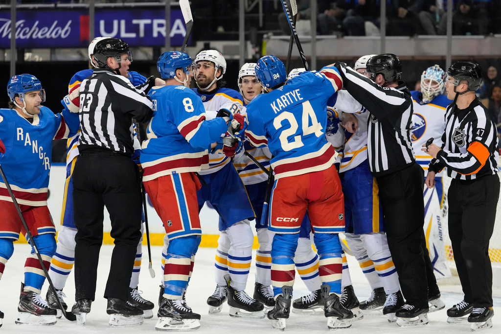 New York Rangers center J.T. Miller (8) fights with Buffalo Sabres right wing Alex Tuch (89) during the first period of an NHL hockey game, Wednesday, April 8, 2026, in New York. (AP Photo/Yuki Iwamura)