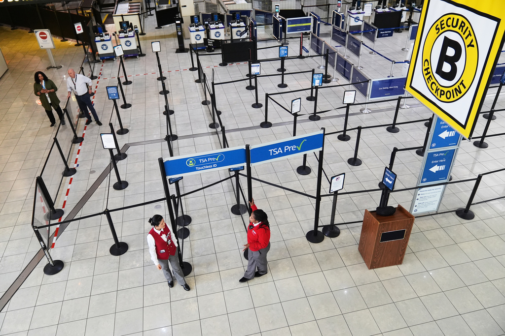 A closed security checkpoint is seen empty at Baltimore/Washington International Thurgood Marshall Airport in Baltimore, Monday, March 23, 2026. (AP Photo/Stephanie Scarbrough)