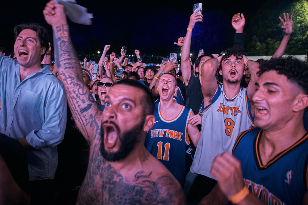 New York Knicks fans celebrate their victory as they watch Game 5 of the NBA Finals basketball series against the San Antonio Spurs, Saturday, June 13, 2026, in New York. (AP Photo/Andres Kudacki)