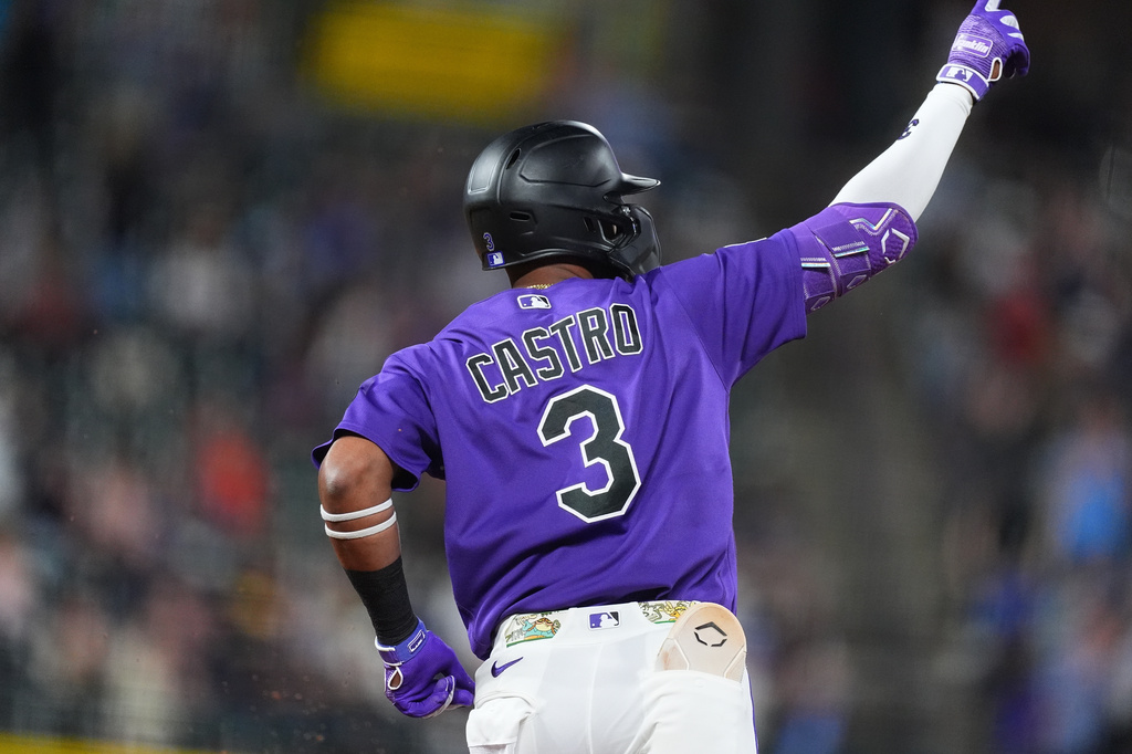 Colorado Rockies' Willi Castro gestures to the bullpen as he circles the bases after hitting a two-run home run off Houston Astros starting pitcher Mike Burrows in the fourth inning of a baseball game Tuesday, April 7, 2026, in Denver. (AP Photo/David Zalubowski)
