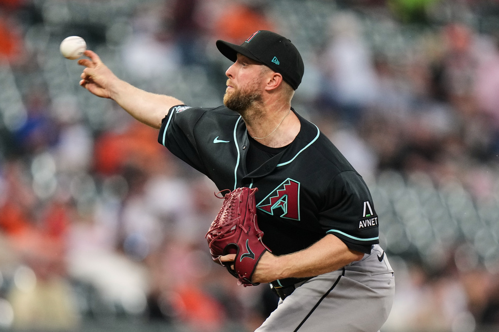 Arizona Diamondbacks starting pitcher Merrill Kelly delivers during the second inning of a baseball game against the Baltimore Orioles, Tuesday, April 14, 2026, in Baltimore. (AP Photo/Stephanie Scarbrough)
