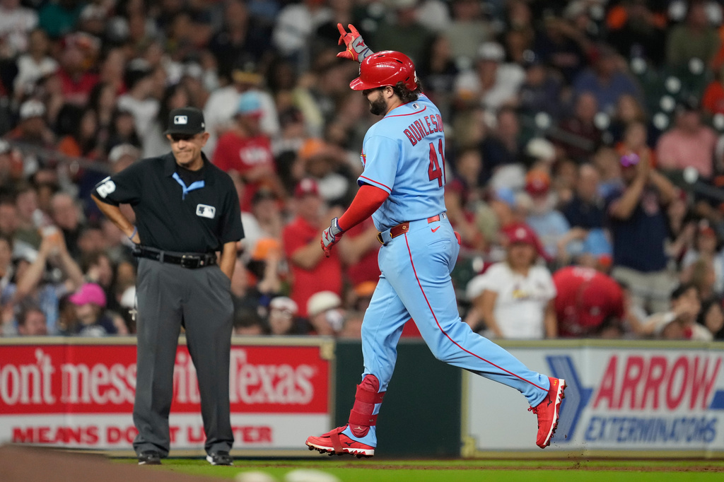 St. Louis Cardinals' Alec Burleson celebrates as he runs the bases after hitting a home run during the seventh inning of a baseball game against the Houston Astros in Houston, Saturday, April 18, 2026. (AP Photo/Ashley Landis)