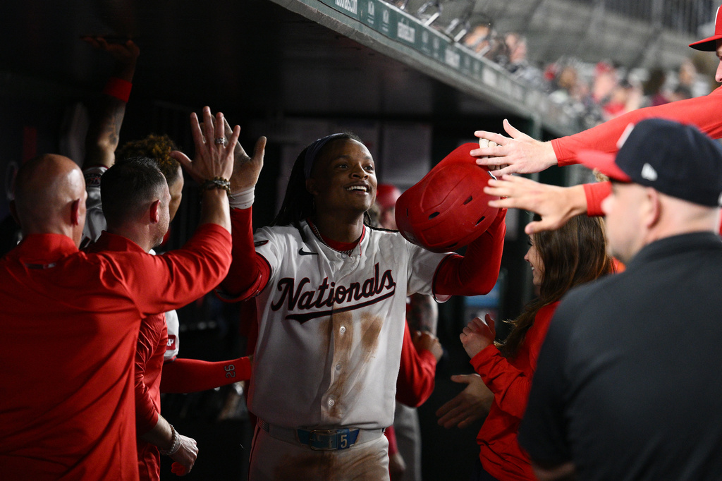 Washington Nationals' CJ Abrams celebrates his grand slam during the eighth inning of a baseball game against the Minnesota Twins, Wednesday, May 6, 2026, in Washington. (AP Photo/Nick Wass)