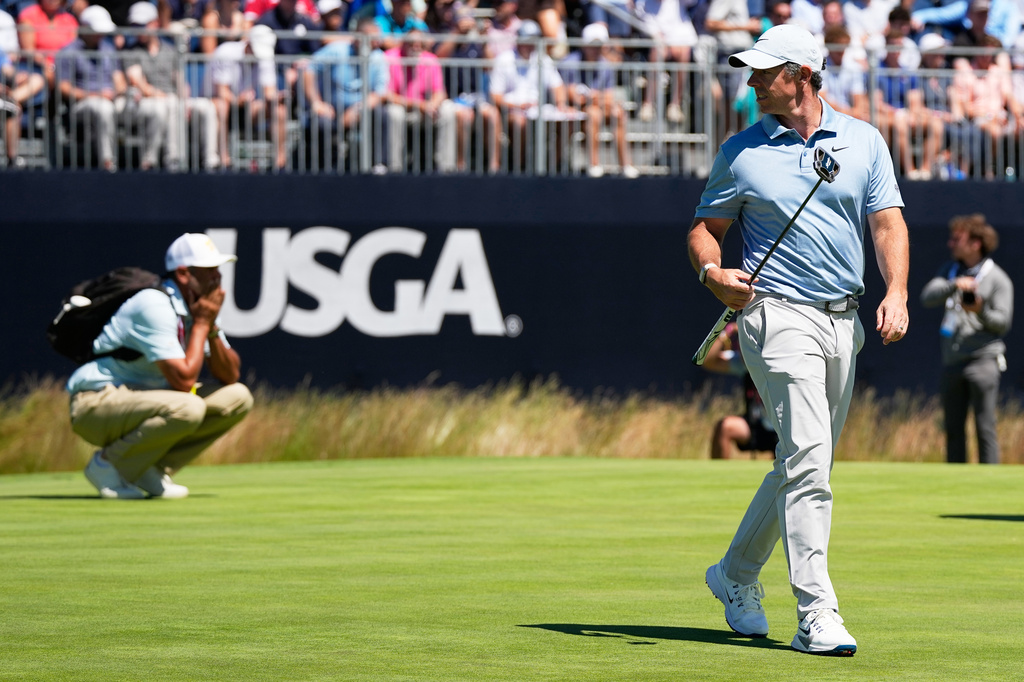 Rory McIlroy, of Northern Ireland, walks on the second green during a practice round for the U.S. Open golf tournament at Shinnecock Hills Golf Club in Southampton, N.Y., Tuesday, June 16, 2026.(AP Photo/David J. Phillip)
