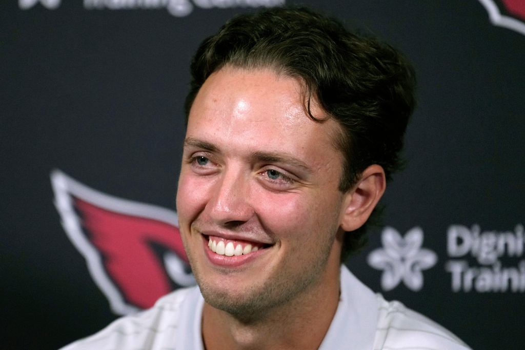 FILE - Arizona Cardinals quarterback Carson Beck smiles as he listens to a question during a news conference at the team's NFL football training facility on June 17, 2026, in Tempe, Ariz. (AP Photo/Ross D. Franklin, File)