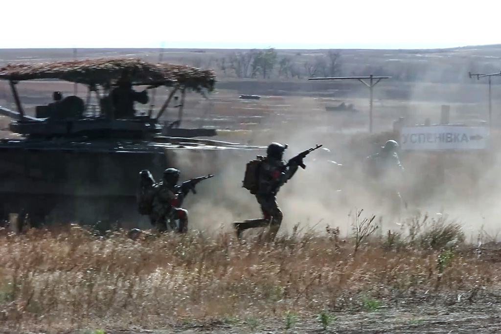 In this image made from video provided by the Russian Defense Ministry Press Service on Friday, Oct. 31, 2025, Russian servicemen attend a practice for sabotage operations behind enemy lines at a training ground on an undisclosed location. (Russian Defense Ministry Press Service via AP)