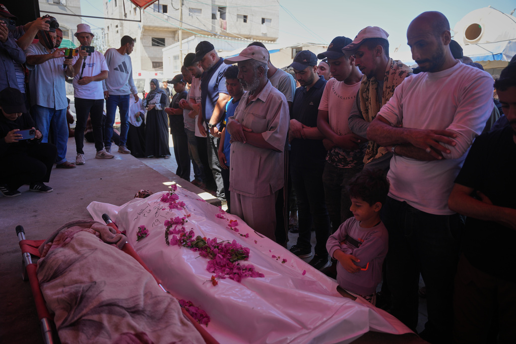 Palestinians perform funeral prayers for Ali Asbitan, 28, who was killed in an Israeli airstrike, in Deir al-Balah, Gaza Strip, Monday, June 29, 2026. (AP Photo/Abdel Kareem Hana)