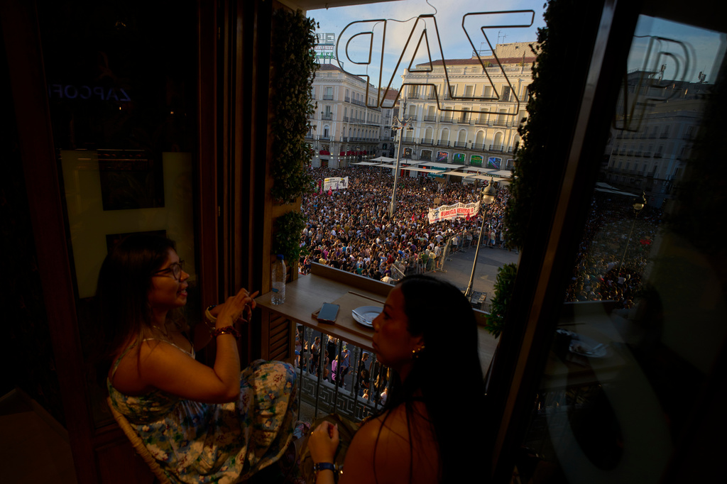 People gather during a protest following the eviction last Wednesday of 87-year-old Maricarmen to demand stronger laws to protect renters at Puerta del Sol in Madrid, Spain, Saturday, Sept. 26, 2026. (AP Photo/Manu Fernandez)