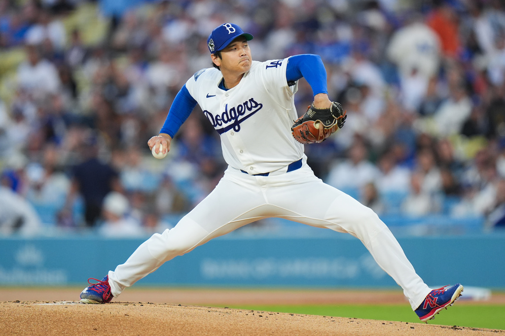 Los Angeles Dodgers starting pitcher Shohei Ohtani throws against the New York Mets during the first inning of a baseball game Wednesday, April 15, 2026, in Los Angeles. (AP Photo/Jae C. Hong)