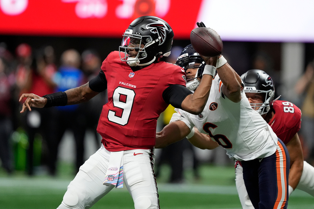 Chicago Bears cornerback Kyler Gordon (6) pressures Atlanta Falcons quarterback Michael Penix Jr. (9) during the second half of an NFL football game in Atlanta, Sunday, Oct. 18, 2026. (AP Photo/Brynn Anderson)