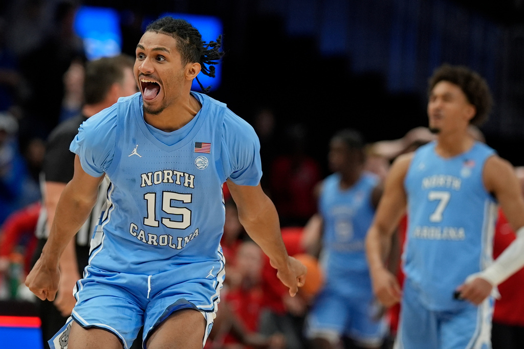 North Carolina forward Jarin Stevenson (15) celebrates victory over North Carolina after an NCAA basketball game, Saturday, Dec. 20, 2025, in Atlanta. (AP Photo/Mike Stewart)