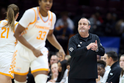 FILE - South Florida head coach Jose Fernandez, right, looks on as Tennessee pulls away during the fourth quarter of the first round of the NCAA college basketball tournament, March 21, 2025, in Columbus, Ohio. (AP Photo/Joe Maiorana, File) FILE - South Florida head coach Jose Fernandez, right, looks on as Tennessee pulls away during the fourth quarter of the first round of the NCAA college basketball tournament, March 21, 2025, in Columbus, Ohio. (AP Photo/Joe Maiorana, File)