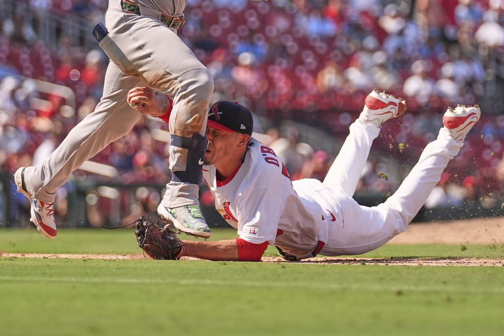 St. Louis Cardinals relief pitcher Riley O'Brien tags out New York Yankees' Jasson Dominguez during the eighth inning of a baseball game Sunday, Aug. 17, 2025, in St. Louis. (AP Photo/Jeff Roberson)