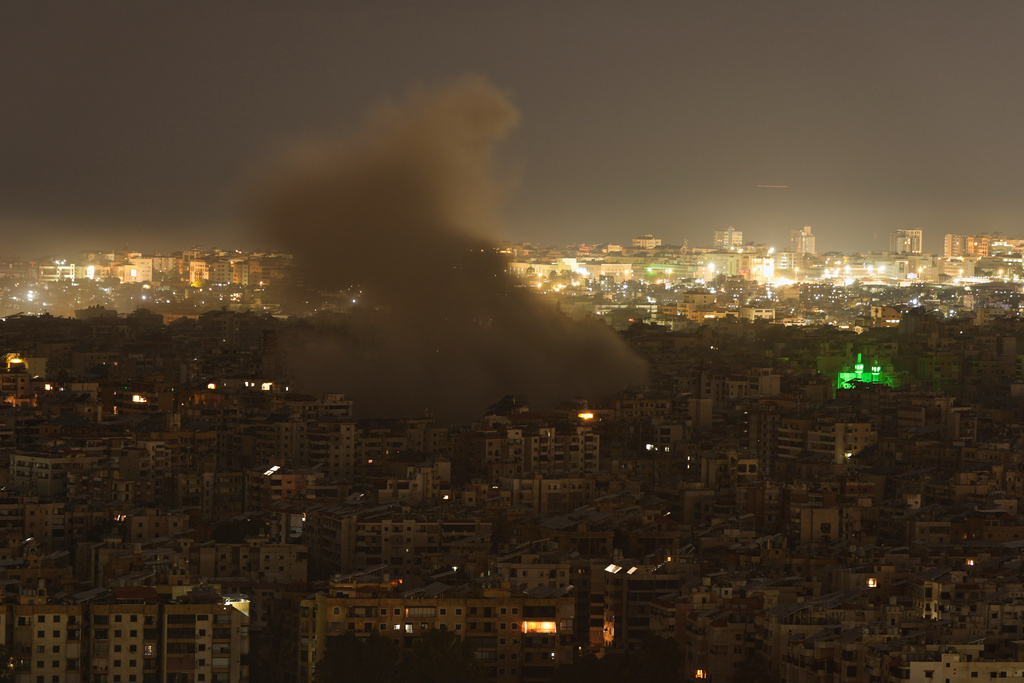 Smoke rises from the site of an Israeli airstrike in Dahiyeh, Beirut's southern suburbs, Monday, March 23, 2026. (AP Photo/Hassan Ammar)