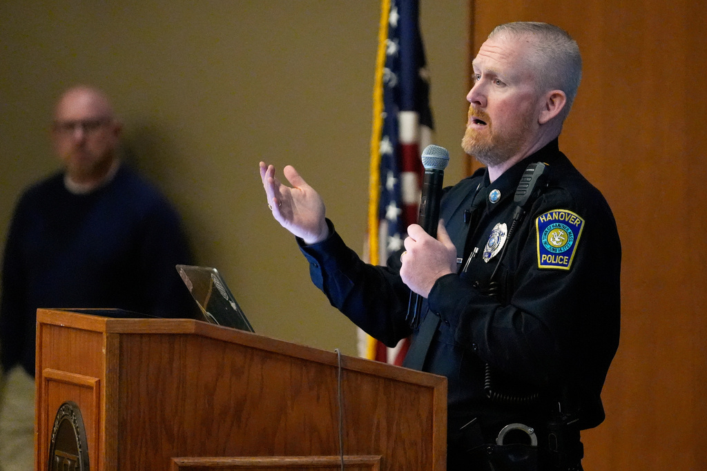School Resource Officer John Voelkel speaks about ways to prevent school shootings during a presentation of Sandy Hook Promise's "Say Something" program at Hanover High School, Wednesday, March 25, 2026, in Hanover, Mass. (AP Photo/Robert F. Bukaty)