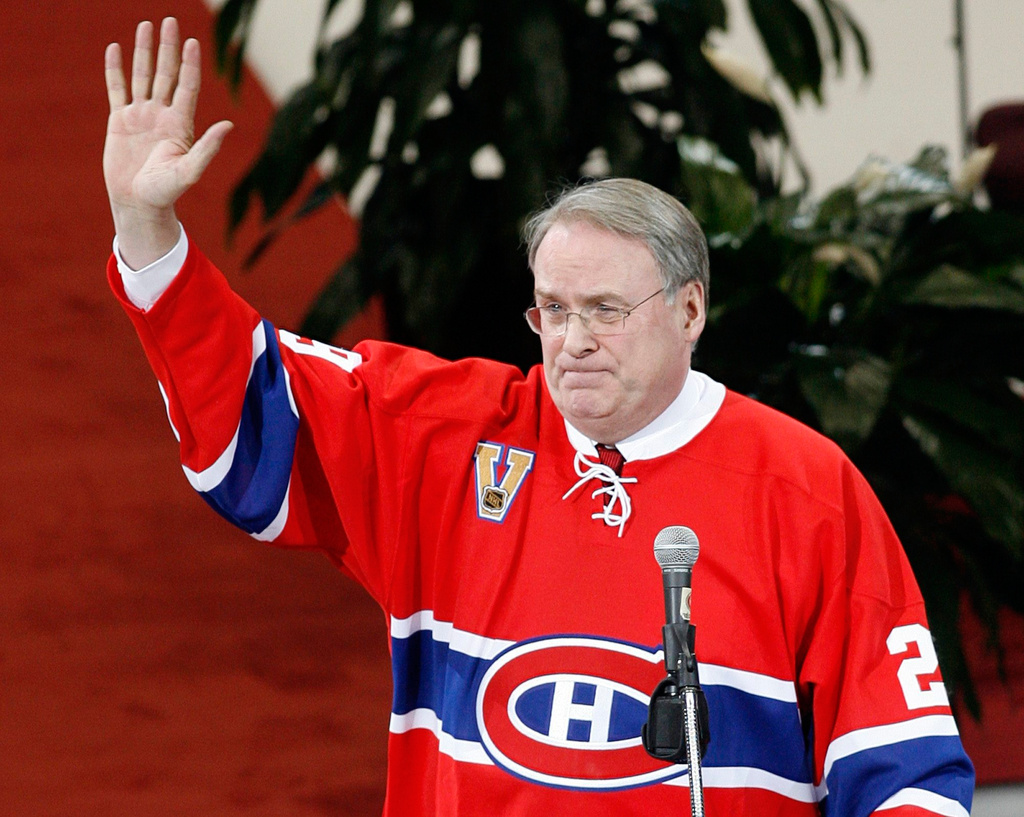 FILE - Former Montreal Canadiens goaltender Ken Dryden waves to the crowd at the Bell Centre as his number is retired during a pre-game ceremony, on Jan. 29, 2007 in Montreal. (Ryan Remiorz/The Canadian Press via AP, File)