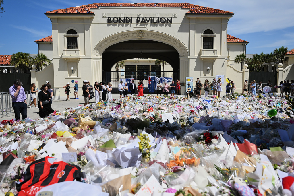 Floral tributes outside Bondi Pavilion at Bondi Beach in Sydney, Thursday, Dec. 18, 2025. (AP Photo/Steve Markham)