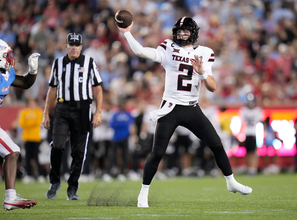 Texas Tech quarterback Behren Morton (2) passes the ball against Houston during the second half of an NCAA college football game, Saturday, Oct. 4, 2025, in Houston. (AP Photo/Karen Warren)
