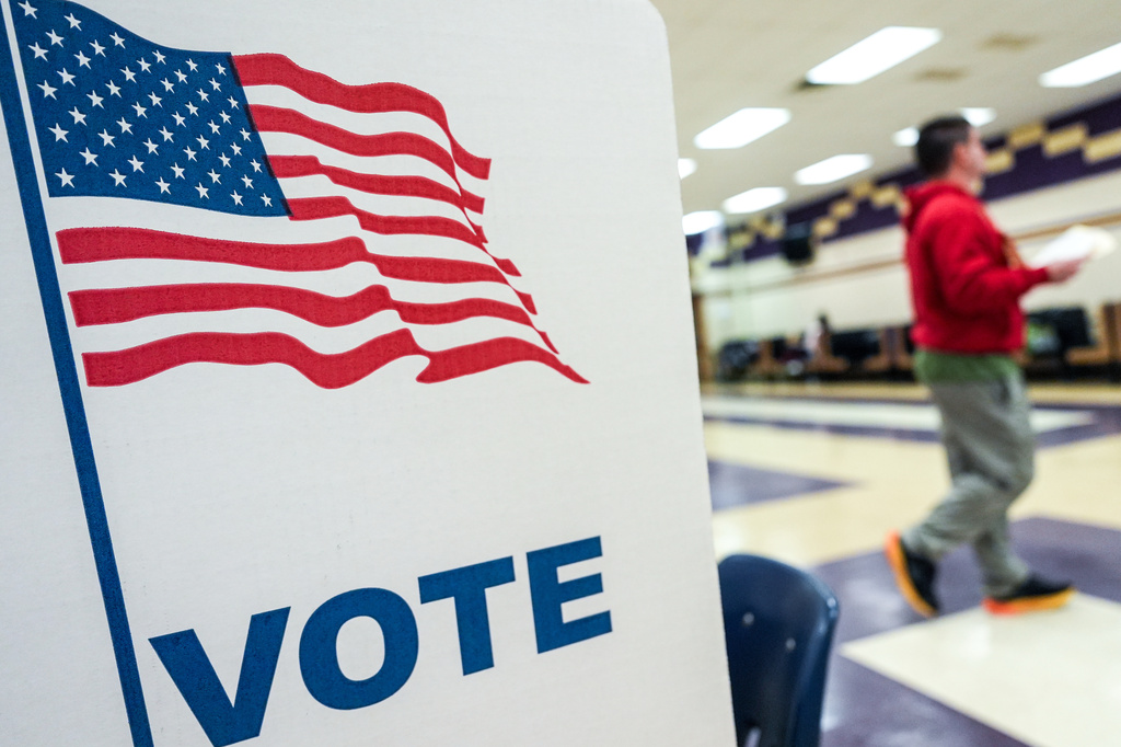 A person votes in the Virginia redistricting referendum at Lake Braddock Secondary School, Tuesday, April 21, 2026, in Burke, Va. (AP Photo/Julia Demaree Nikhinson)