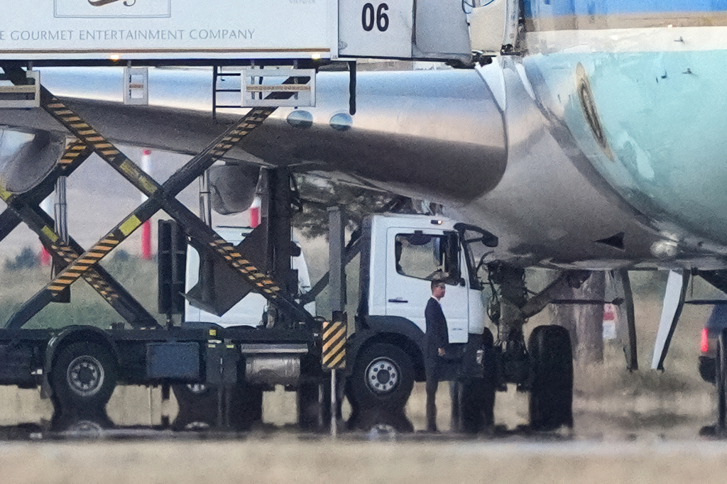 Catering trucks are parked at Air Force One on the tarmac as the motorcade carrying U.S. President Donald Trump arrives to depart following the NATO summit at Ankara International Airport in Ankara, Turkey, Wednesday, July 8, 2026. (AP Photo/Alex Brandon)