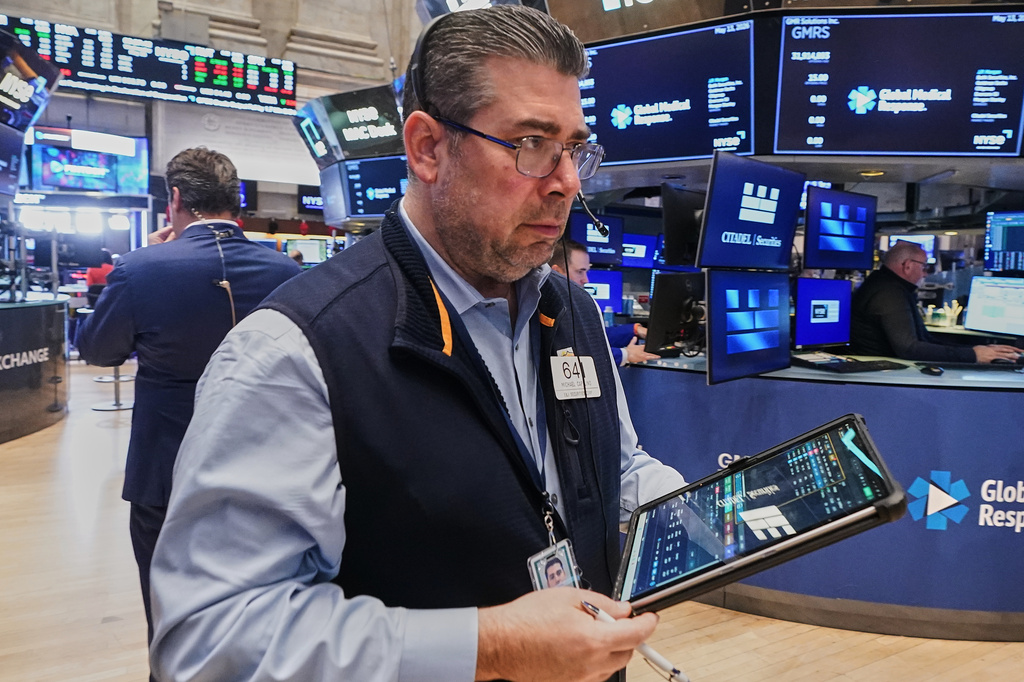 Trader Michael Capolino works on the floor of the New York Stock Exchange, Wednesday, May 13, 2026. (AP Photo/Richard Drew)