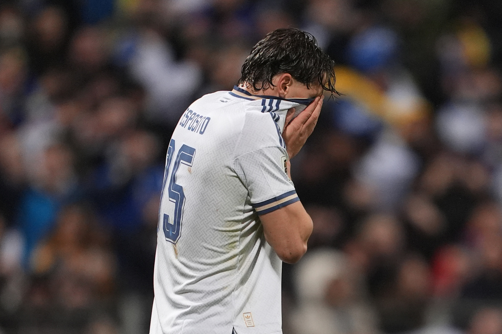 Italy's Pio Esposito reacts after missing a penalty kick during a World Cup qualifying playoff final soccer match between Bosnia and Italy in Zenica, Bosnia, Tuesday, March 31, 2026. (Fabio Ferrari/LaPresse via AP)
