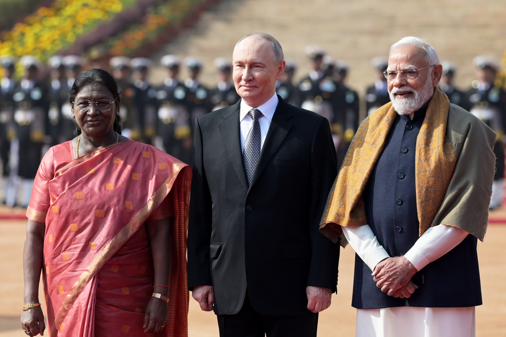 Russian President Vladimir Putin, center, poses for a photograph with Indian Prime Minister Narendra Modi, right, and Indian President Droupadi Murmu during a ceremonial reception at the Rashtrapati Bhavan in New Delhi, India, Friday, Dec. 5, 2025. (AP Photo)