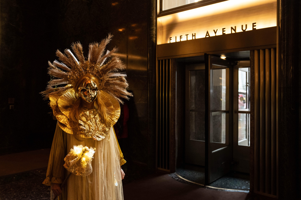 Henrieta Scholtzova stands inside Rockefeller Center during the Easter Bonnet Parade on Fifth Avenue, Sunday, April 5, 2026, in New York. (AP Photo/Adam Gray)