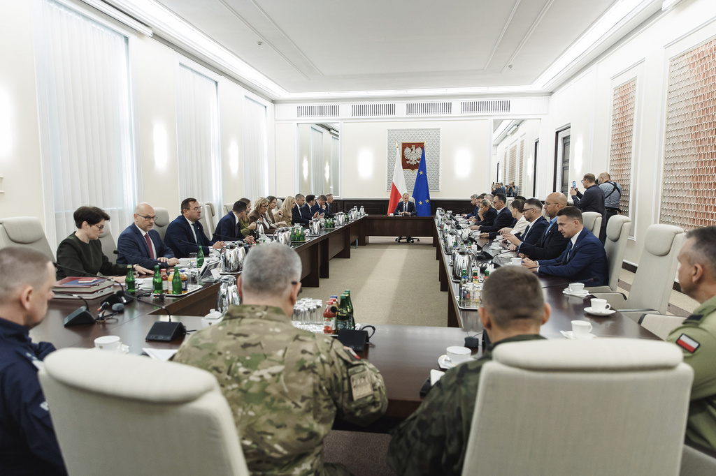 Polish Prime Minister Donald Tusk holds an extraordinary government meeting at the chancellery, with military and emergency services officials, following violations of Polish airspace during a Russian attack, in Warsaw, Poland, Wednesday, Sept. 10, 2025. (Chancellery of the Prime Minister of Poland via AP)